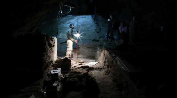 archaeologists in a tomb