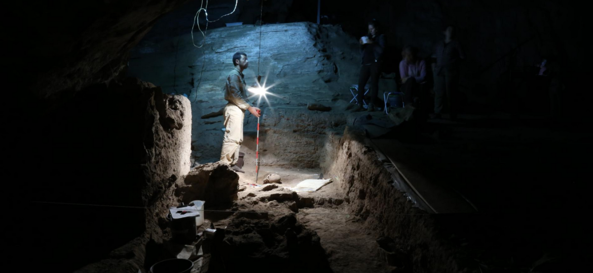 archaeologists in a tomb